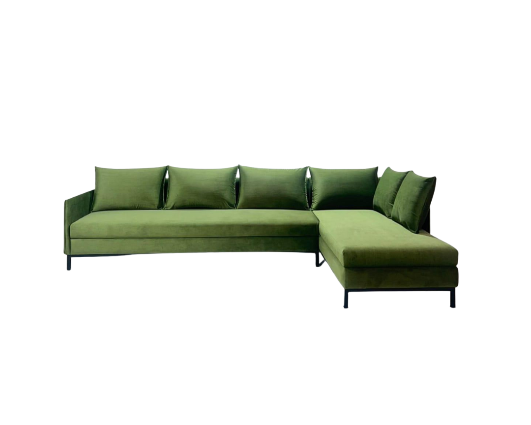 Green sectional sofa on a white background